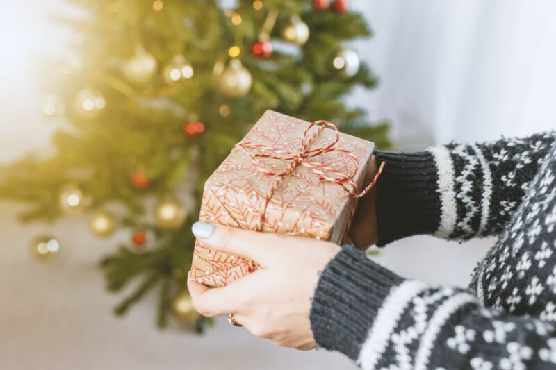 woman handing over gifts